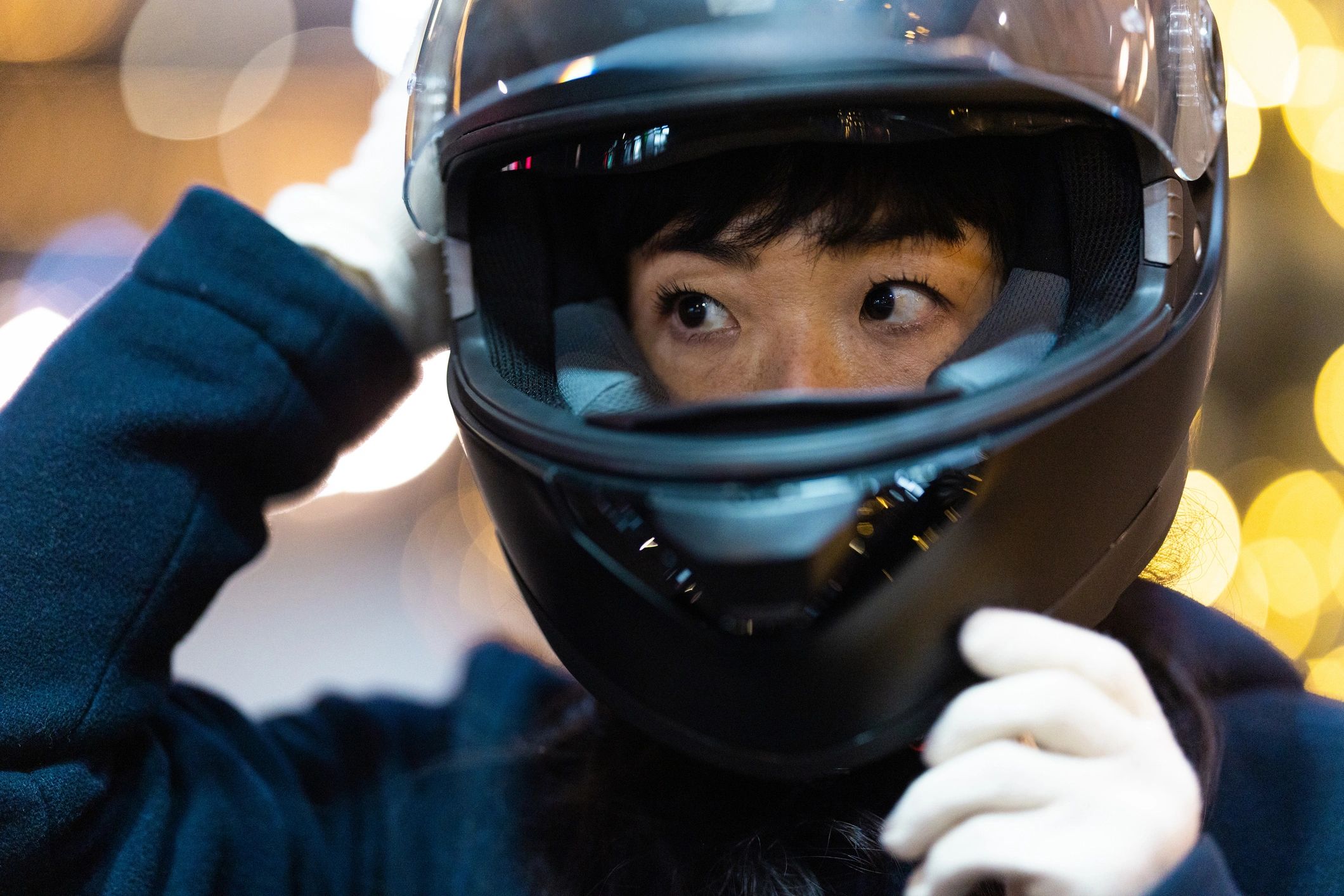 Close-up of a rider wearing protective motorcycle gear